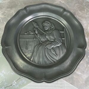 Vintage Cheswick PA action industries high relief pewter. Woman spinning yarn.
